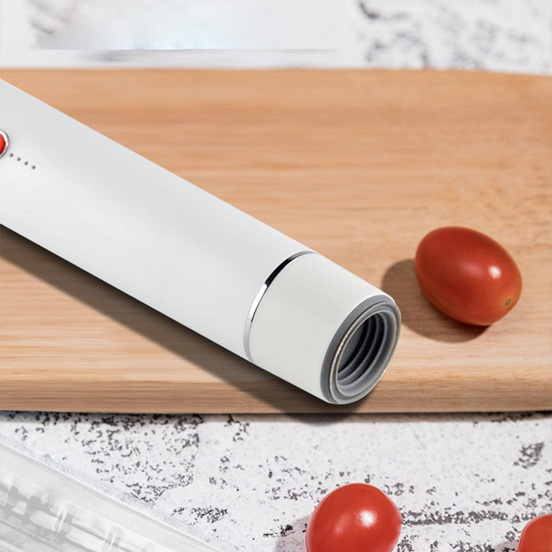 H9 food sealer in white with red button, shown with USB charging cable