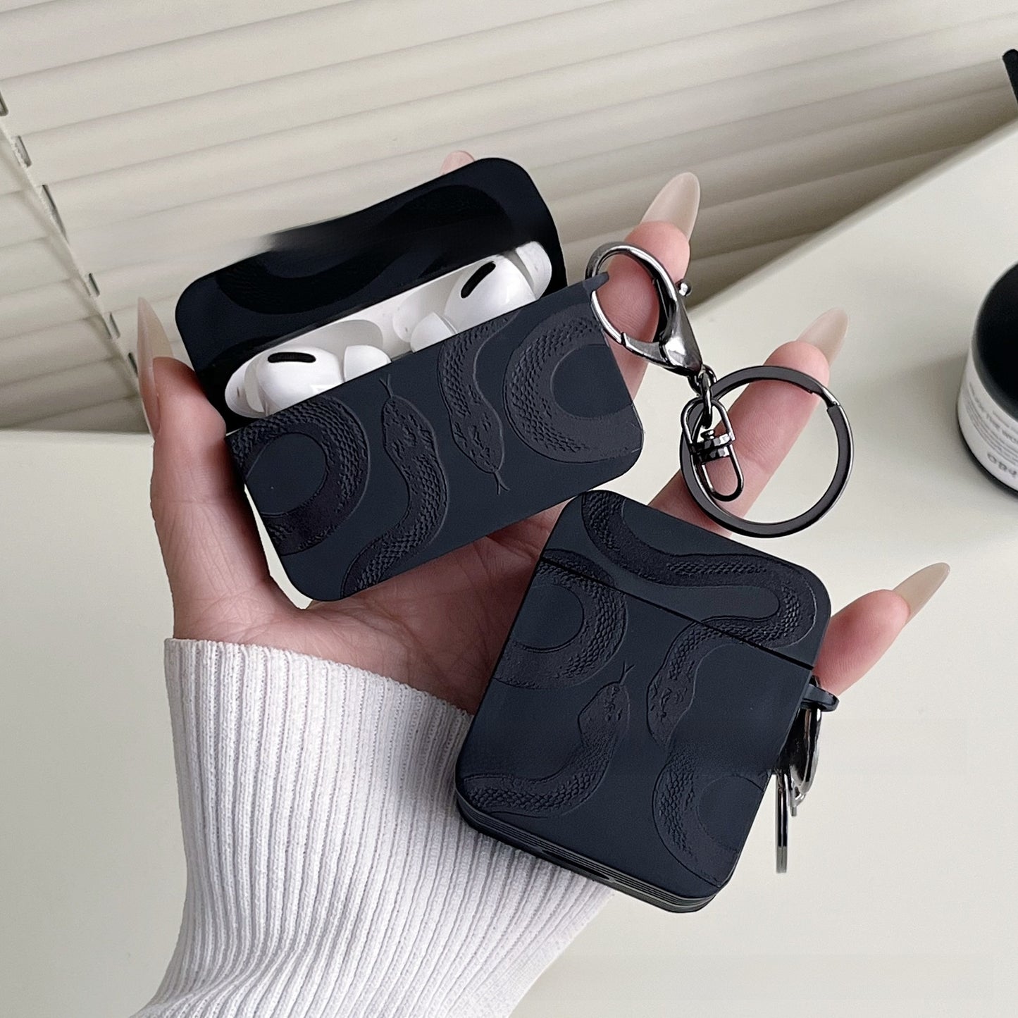Double snake case fitted to AirPods Pro 3 charging case