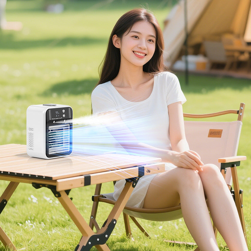 Portable mist fan shown with its USB charging cable